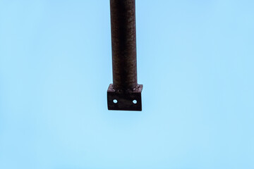 Iron stick against the blue sky. Abstract background
