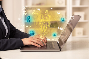 Doctor working on laptop with healthcare concept