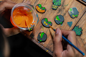 Craft pins made of acrylic and colored using enamel paint, all done manually in a home workshop