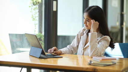 Businesswoman using portable tablet computer.