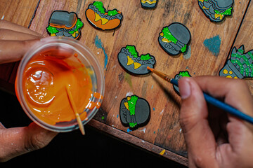 Craft pins made of acrylic and colored using enamel paint, all done manually in a home workshop - obrazy, fototapety, plakaty