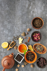 Fototapeta na wymiar Set natural dried tea and teapot. Teatime. Tea ceremony concept. Top view. Flat lay.
