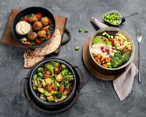 Brussel sprout salad with bulgur on dark background.