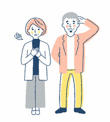 困った表情の中年カップル　全身