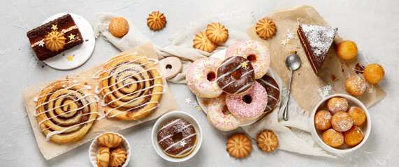Desserts assortment on light background.