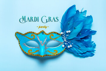 Mardi gras lettering. Congratulation card with mask on blue background Top view 2022 Mardi Gras...