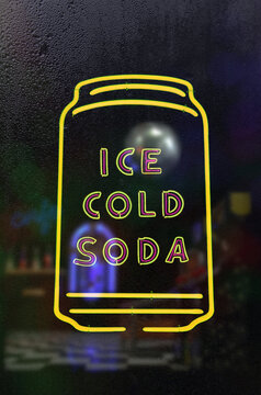 Neon Ice Cold Cola Sign in Rainy Wet Window