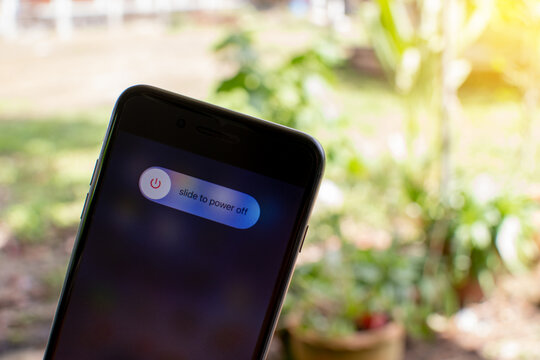 Songkhla, Hatyai, Thailand Nov 28, 2020: Slide to power off on the screen Apple iPhone 7 plus color black, Closeup photography And the blurred background is bokeh beautiful