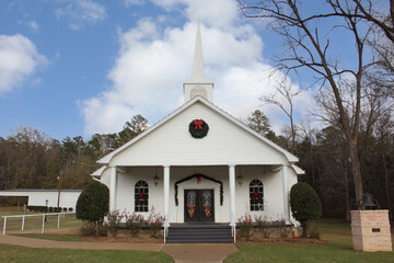 Fototapeta na wymiar Small White Church in Rural East Texas With Christmas Decorations