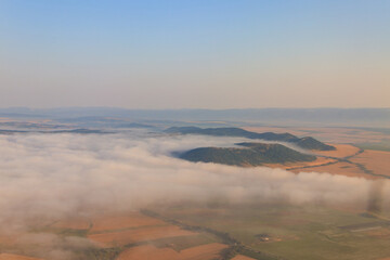 Aerial view of the mountains and fields in Bulgaria. View from a plane