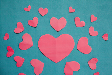 Top view photo with Valentine's Day hearts on an isolated blue background with a copy space
