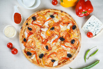 vegetarian pizza with mushrooms, tomatoes and sweet peppers on a white background with ingredients
