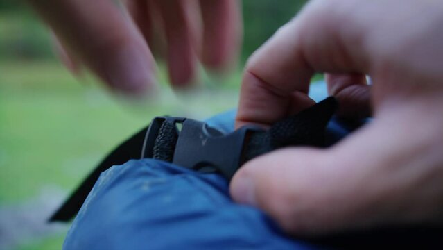 A sleeping back gets tightened with a buckle
