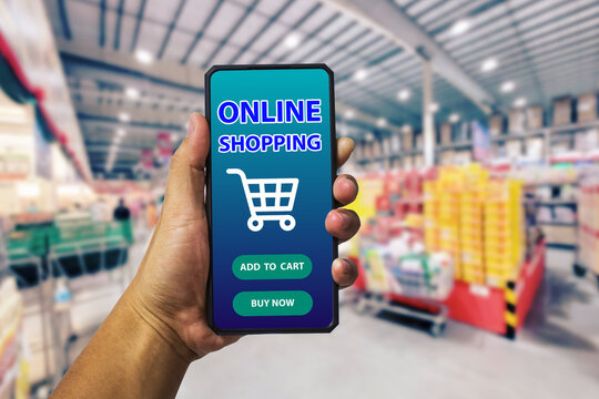 Smart phone online shopping in man hand.Supermarket in background.