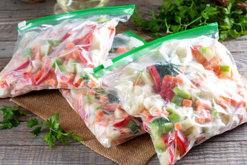 Frozen vegetables in plastic bags on a table
