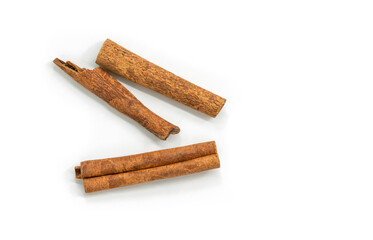 Close up cinnamon stick on white background, top view image of dried cinnamon on white background. Three different shapes of cinnamon stick.