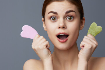beautiful woman scraper gua sha facial care home facial massage close-up Lifestyle