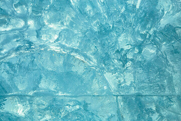 Ice block wall as texture or background. Cold frost transparent bricks pattern