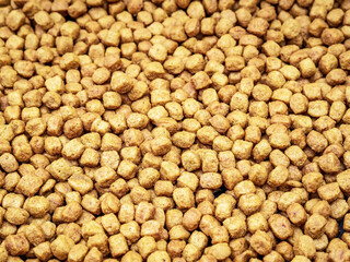 Dry pet food pellets. Top view,  close-up.