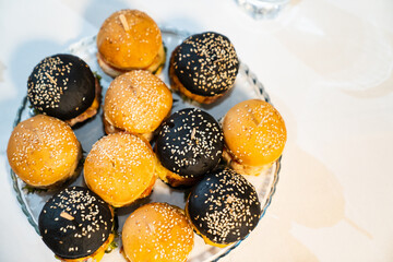 top view. mini burgers. small cheeseburgers for a children's holiday. convenient snacks for the buffet. catering and delivery food from a cafe or restaurant.