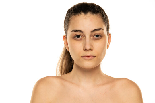 portrait of a young shirtless woman without makeup