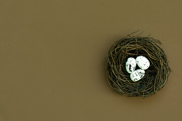 Blue Easter eggs and bouquet of flowers on rustic table wood