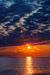 Glowing sunset over the wadden sea between Borkum and Juist, East Frisian Islands, Germany.