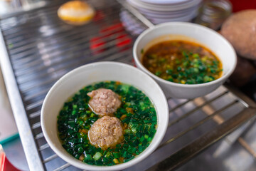 Vietnamese Street Food in Da Lat city, Vietnam - Banh can on the warm ember stove kitchen. Food and travel concept.