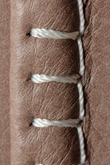 nylon thread stitches natural leather with a decorative seam