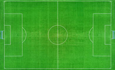 Top view of football ar soccer field with green grass, top view