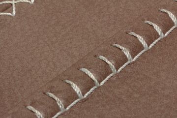 nylon thread stitches natural leather with a decorative seam