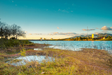 Naklejka premium view of Bien Ho lake near Pleiku city, Gia Lai province, Vietnam. This lake on the lava background of a volcano that has stopped working. Springtime