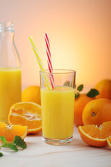 Oranges and orange juice in glasses	