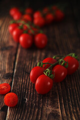 Cherry tomatoes on the table in low key	