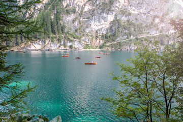Braies lake and boats in the background of Seekofel mountain in Dolomites,Italy 