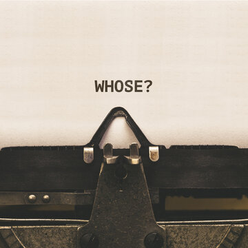 Question Whose, headline text written on vintage type writer from 1920s