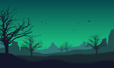 Fototapeta premium Great view of mountains and forest from the countryside with silhouettes of pine trees around