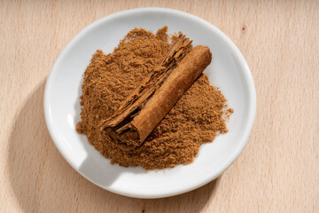 Detailed and large close up shot of cinnamon on a small plate