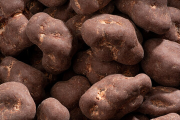 Detailed and large close up shot of chocolate covered fruits.