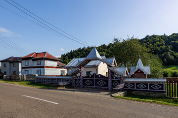 Fototapeta na wymiar Old houses in a Village of Moldovita in the Bucovina in Romania