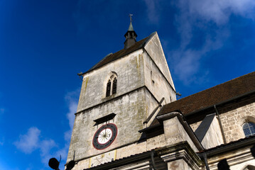 Beautiful collegiate church at little medieval town St-Ursanne, Canton Jura, on a sunny winter day. Photo taken February 7th, 2022, Saint-Ursanne, Switzerland.