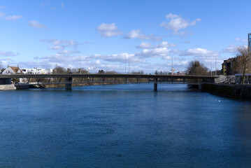 River Aare at City of Solothurn with R&ouml;tibr&uuml;cke (R&ouml;ti Bridge) in the background on a sunny winter day. Photo taken February 7th, 2022, Zurich, Switzerland.
