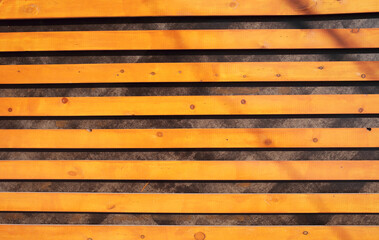 Decorative background of horizontal orange wooden slats