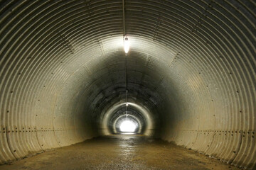 An underground tunnel with lights