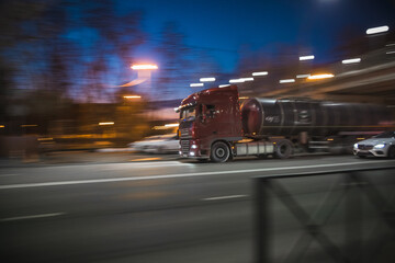Fototapeta premium a truck drives fast through city streets