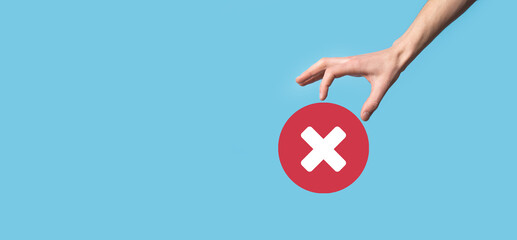 Hand holds icon,cancellation symbol,cancel icon.Cross mark flat red icon.round X mark.cancel...