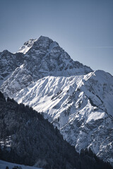 Fototapeta na wymiar snow covered mountains in winter located near the alps in bavaria germany