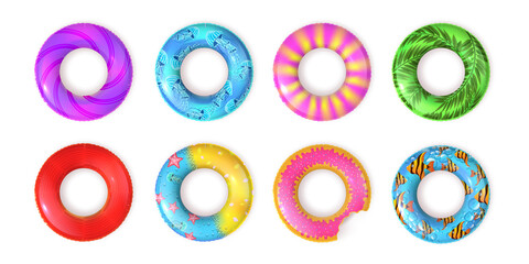 Realistic inflatable rubber swimming rings top view. Kids lifebuoy for pool or sea water with fish and doughnut design. Swim ring vector set