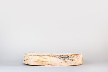 round cut tree on a gray background