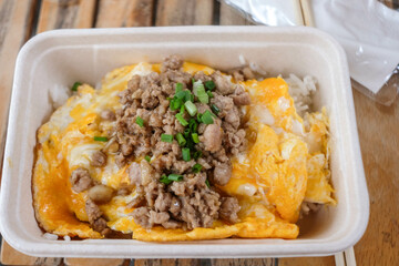 Fried minced pork with garlic pepper and scrambled egg on rice.